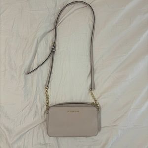Pink crossbody Michael Kors purse